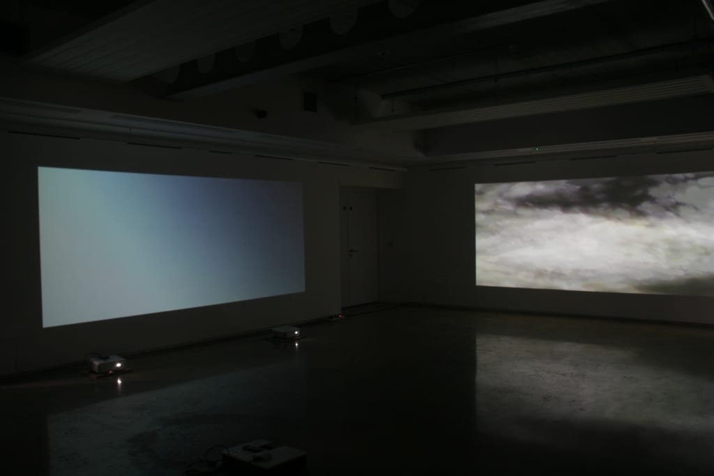 Projected film on three sides illustrated the audio.